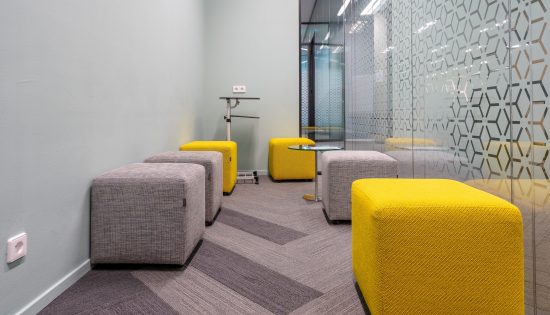 A corner of the open office space with a modern interior design